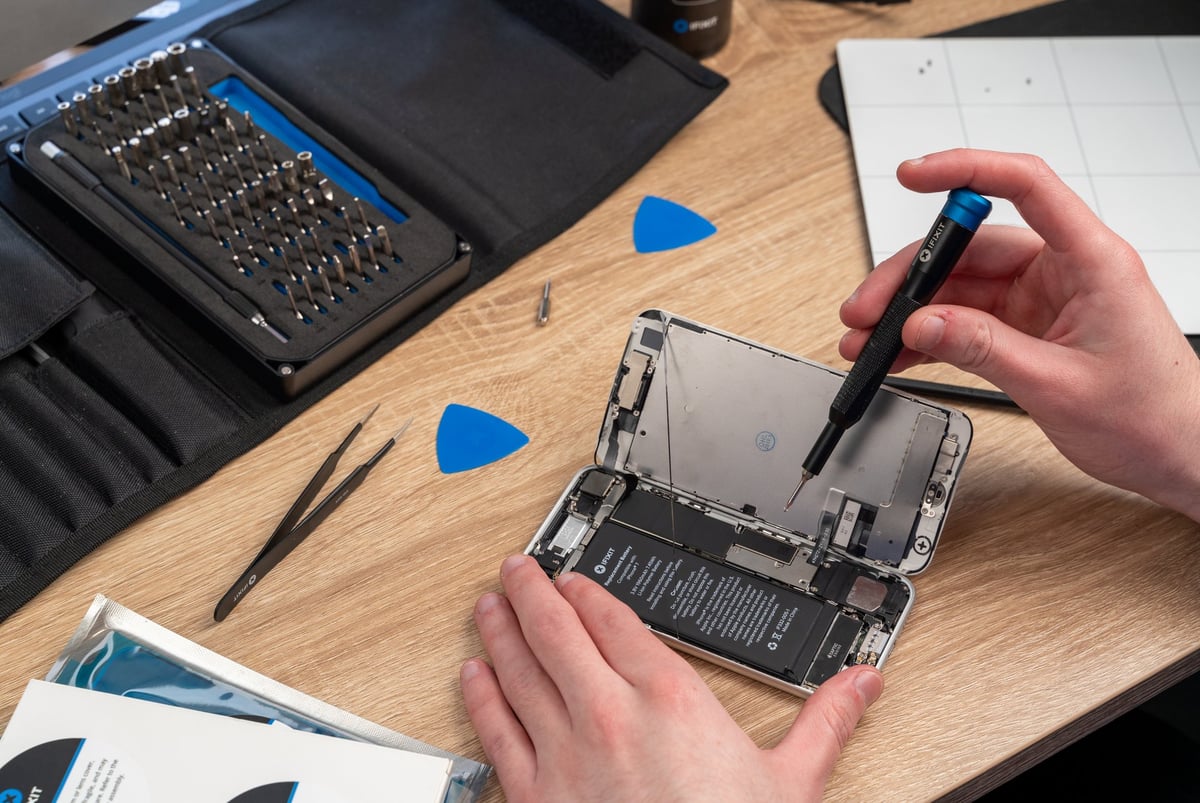 Mac repair workshop with tools and equipment